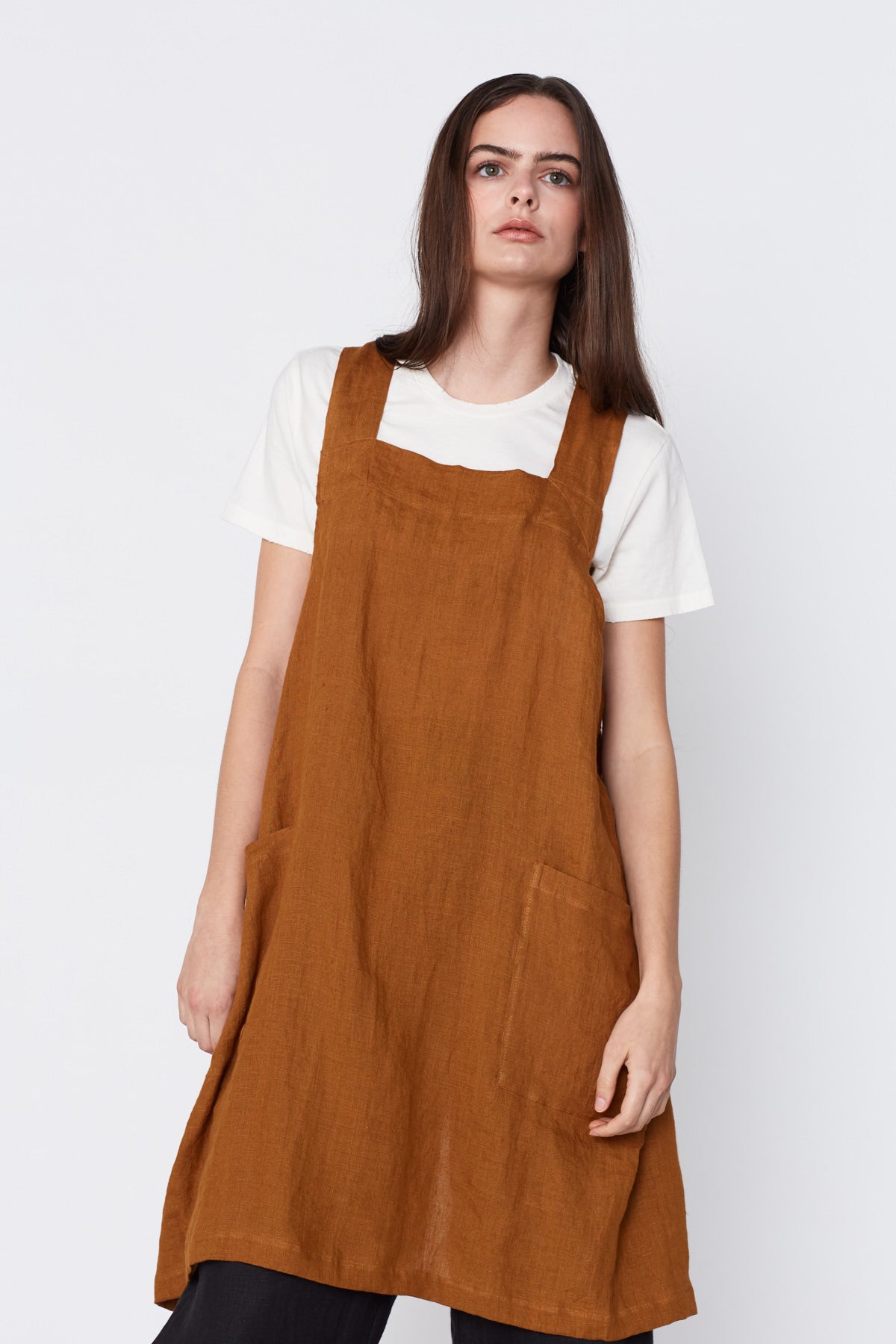 Linen Pinafore Apron in Ocre. Made in Atlanta, ethically and sustainably, by slow fashion designer Megan Huntz. 